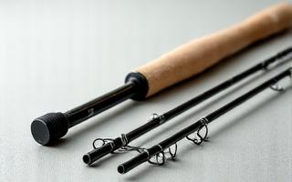 Three-piece travel fishing rod disassembled for transport